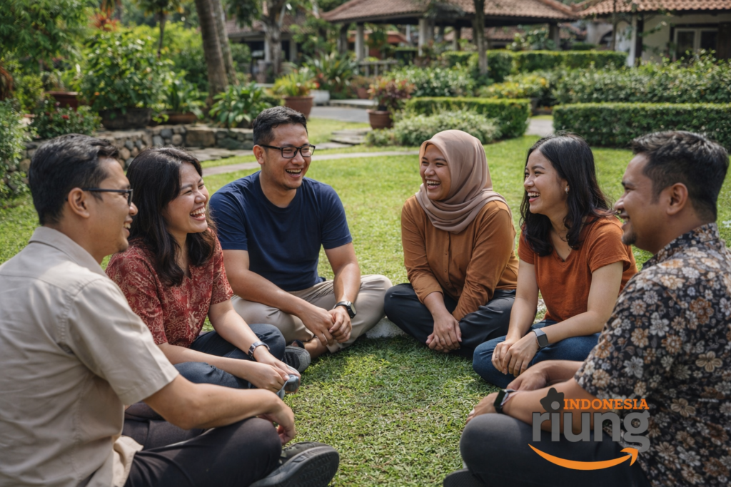 Peserta outing duduk berkelompok kecil berbincang dan tertawa ringan, suasana hangat dan akrab